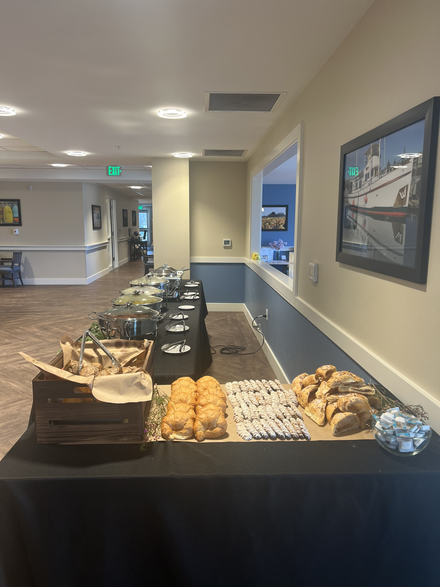 Breakfast Pastry Buffet — Croissants, pastries, and hot food chafers set for morning dining service.