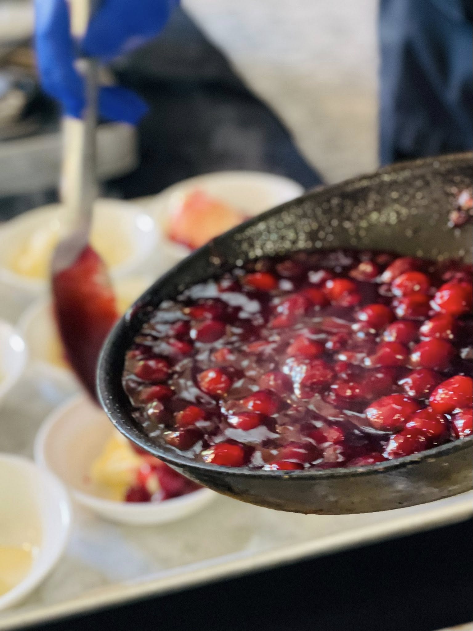 Cherry Compote Preparation — House-made cherry compote prepared fresh for dessert service.