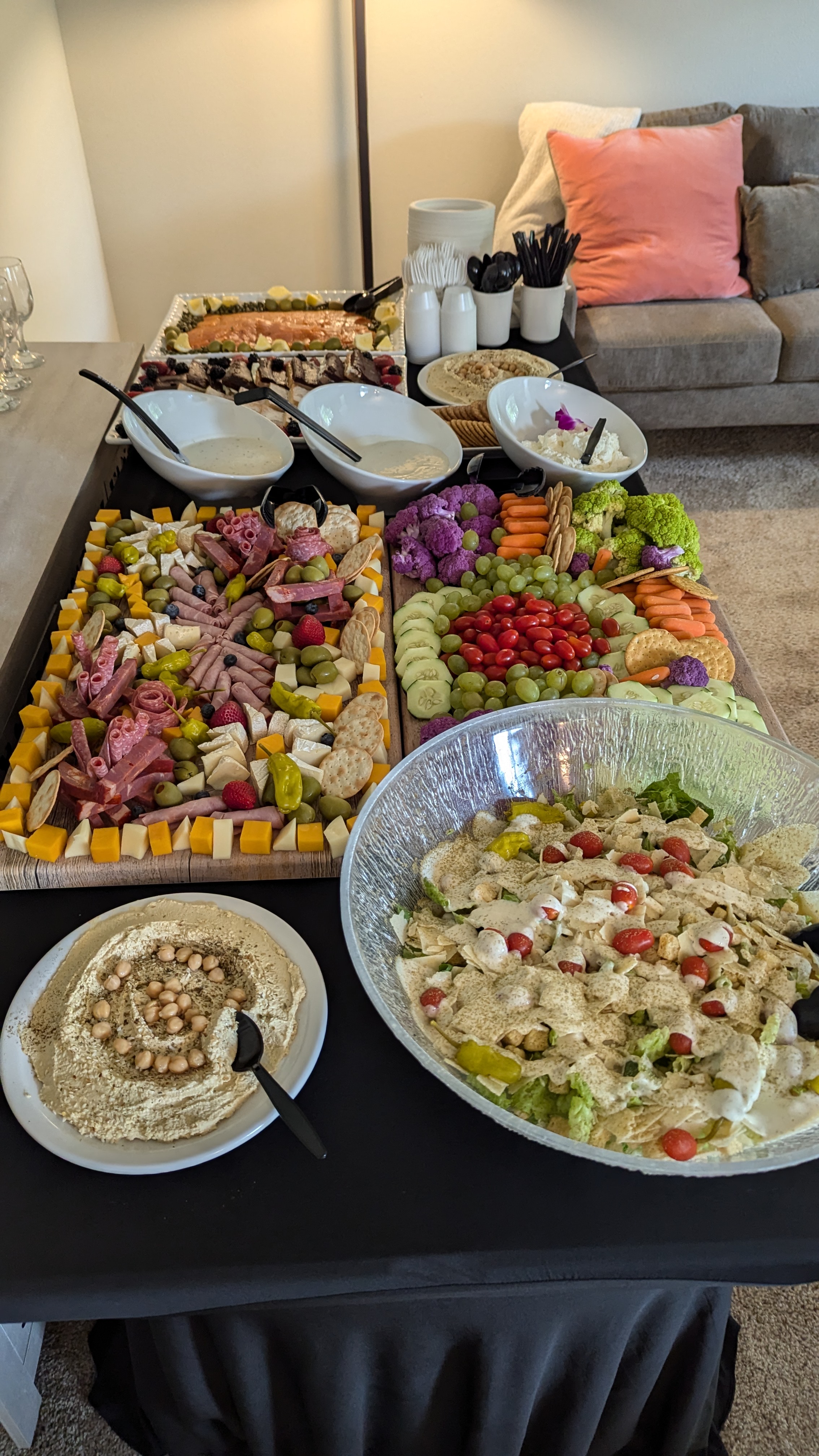 Charcuterie & Crudité Spread — Large-format boards with cheese, cured meats, crudités, hummus, and dips.