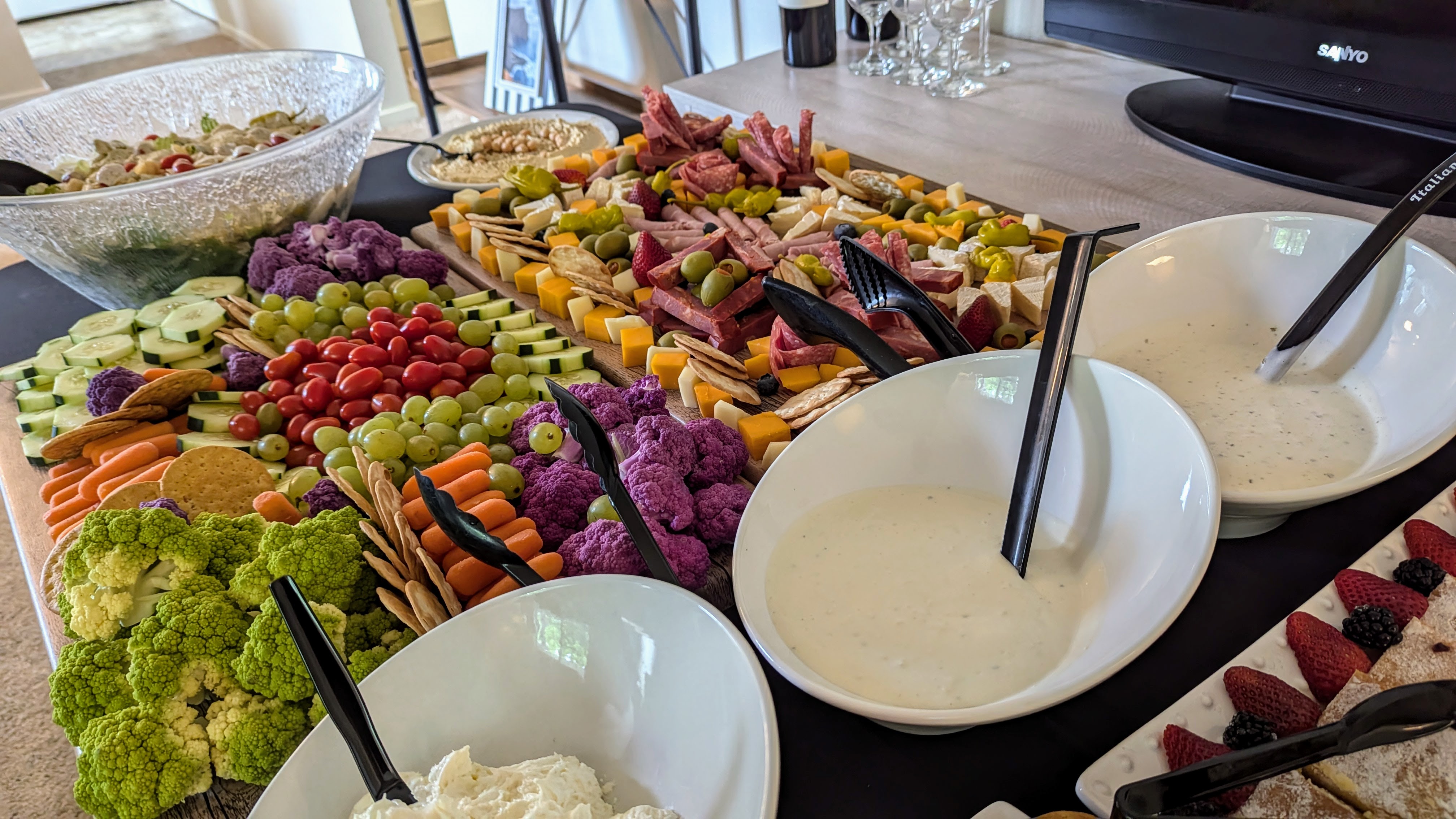 Event Appetizer Display — Charcuterie, fresh vegetables, berries, and house-made dips for a resident event.